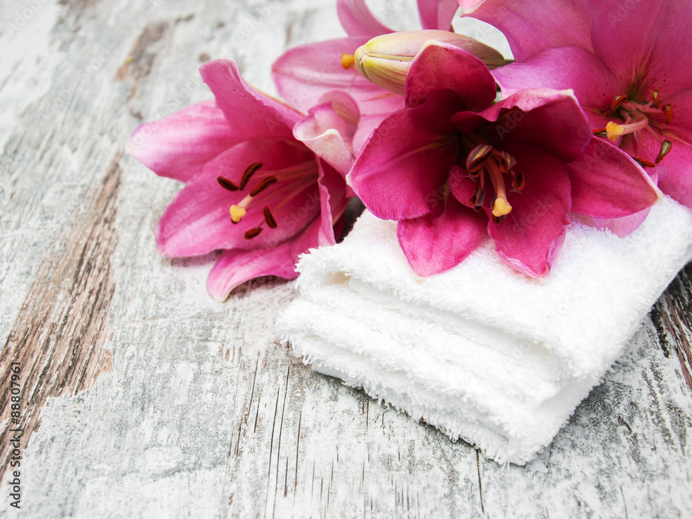 Pink lily and towels Pink lily and towels