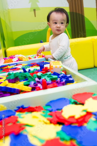 Chinese baby playing puzzle