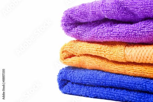 Three multi-colored towels