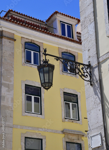 Old iron street lantern on a wall