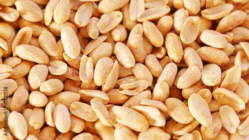 Roasted salty peanuts seed at rotating stand; close up; no people; HD 1080 