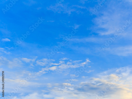 blue sky background with tiny clouds.