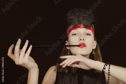 Photography Portrait of a young woman with opium pipe