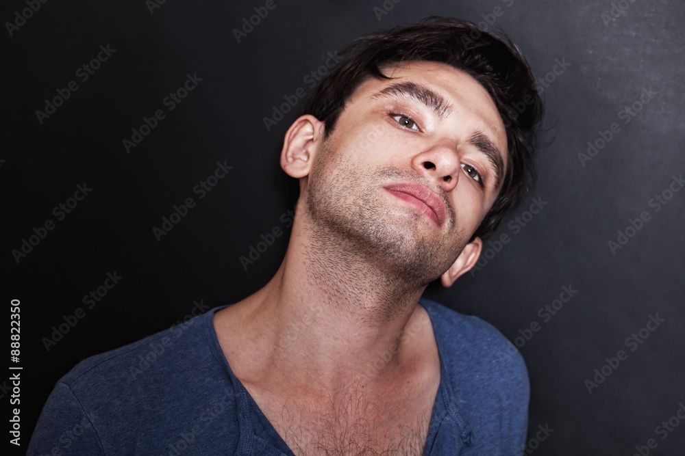 man in a blue shirt on a black background man in a blue shirt on a black background