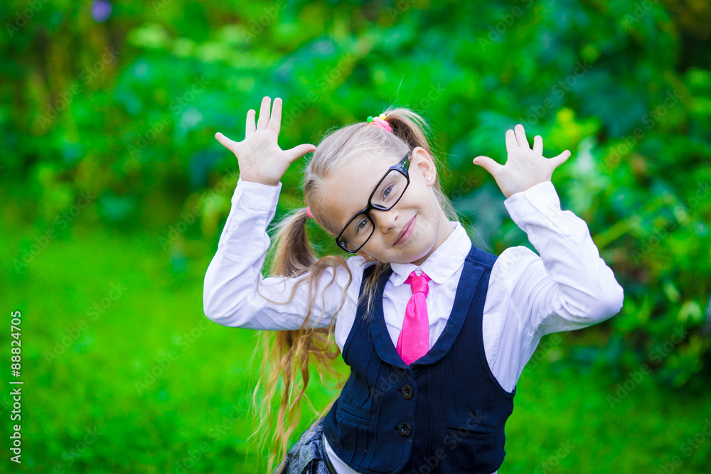 Little happy girl going back to school outdoor Little happy girl going back to school outdoor