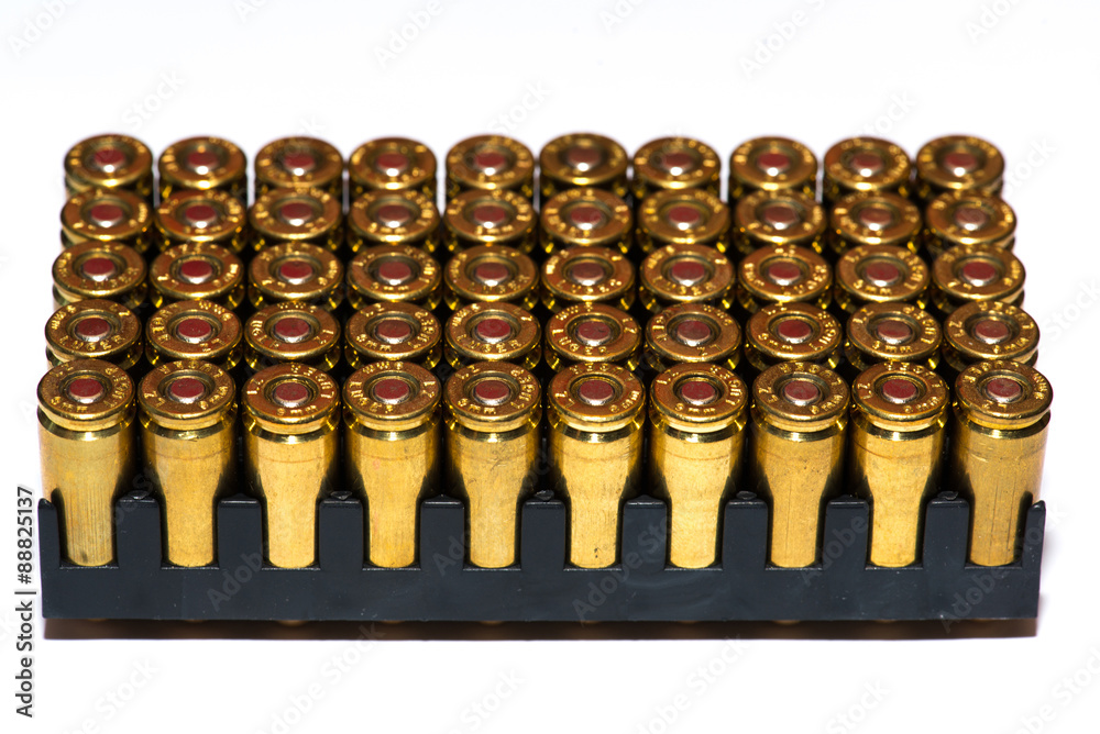 A group of 9mm bullets for a gun isolated on a white background A group of 9mm bullets for a gun isolated on a white background