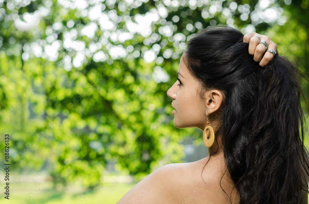 Portrait of a young brunette on nature background Portrait of a young brunette on nature background