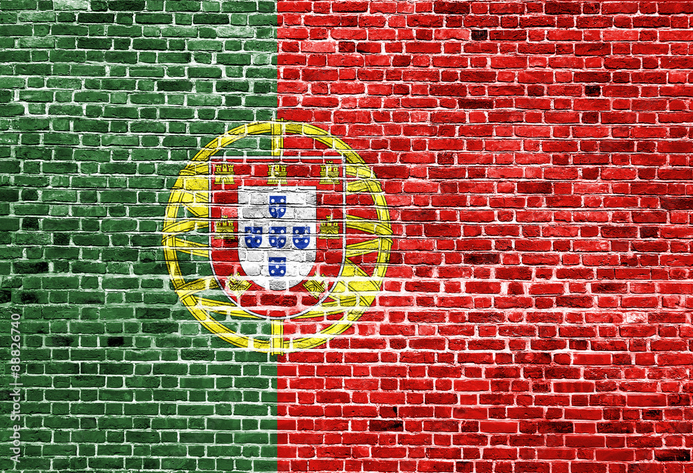 Flag of Portugal painted on brick wall, background texture Flag of Portugal painted on brick wall, background texture