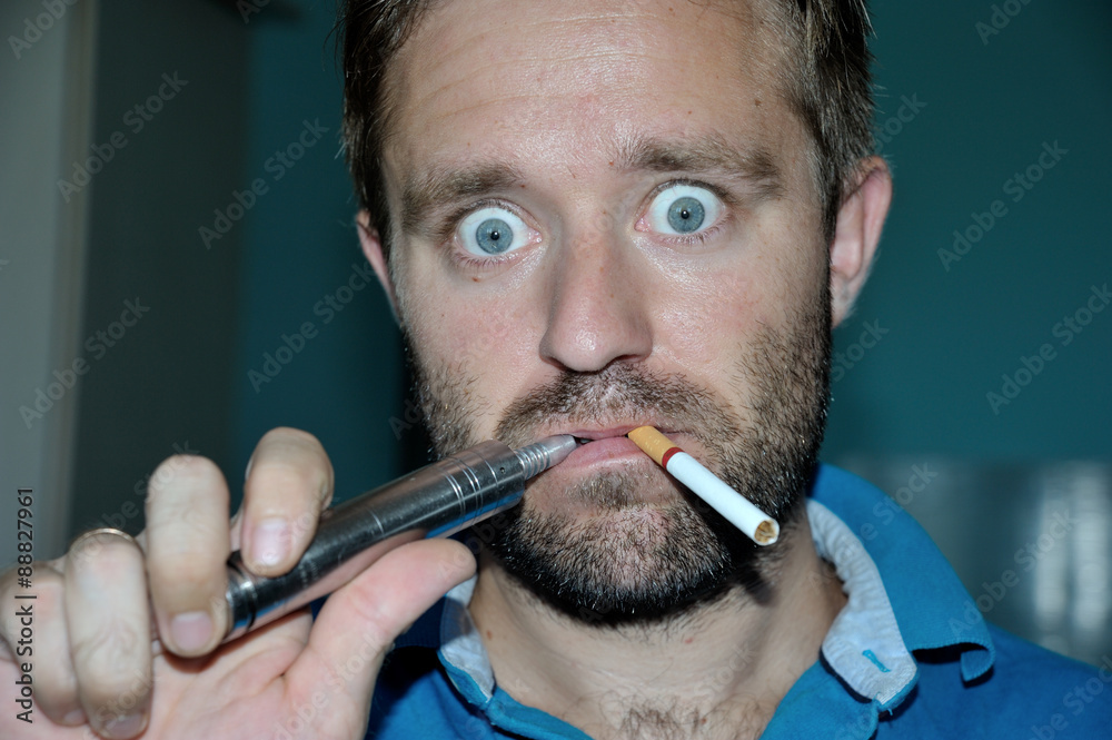 Man smoking e-cigarette, regular cigarette. Make funny face Stock Photo |  Adobe Stock