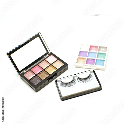 false lashes and cosmetic eyeshadow palette makeup set isolated