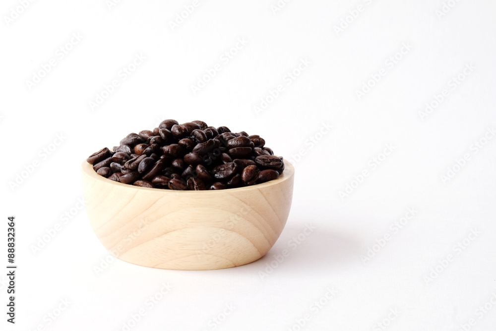 Coffee beans in wooden bowl isolated on white background Coffee beans in wooden bowl isolated on white background