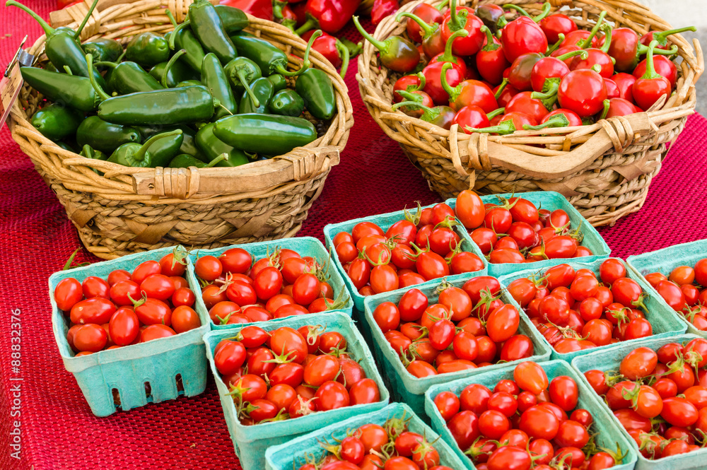 Baskets of peppers and tomatoes Baskets of peppers and tomatoes
