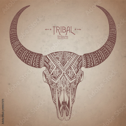 Decorative indian bull scull in tribal style on grunge backgroun