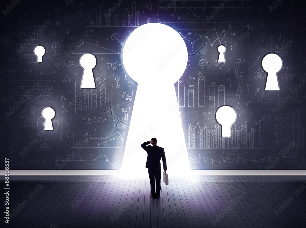 Obraz premium businessman looking through keyhole