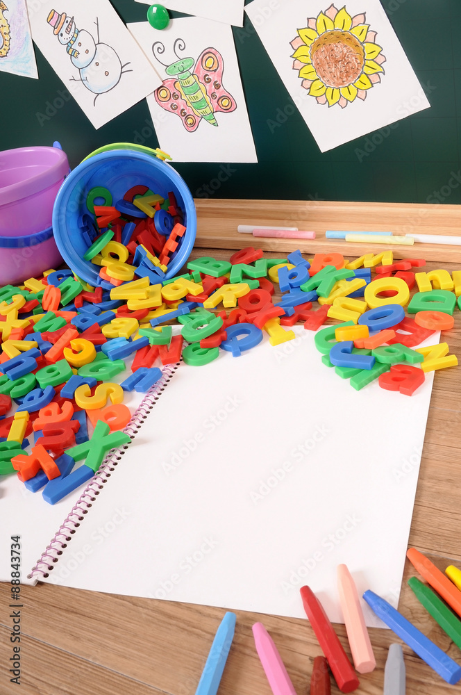 Fototapeta premium Letters of alphabet on school desk