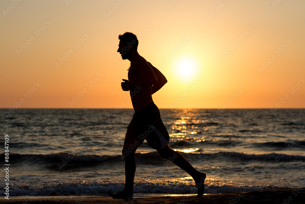 race to the sea at sunset in silhouette race to the sea at sunset in silhouette