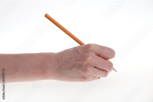 woman's hand holding a pencil