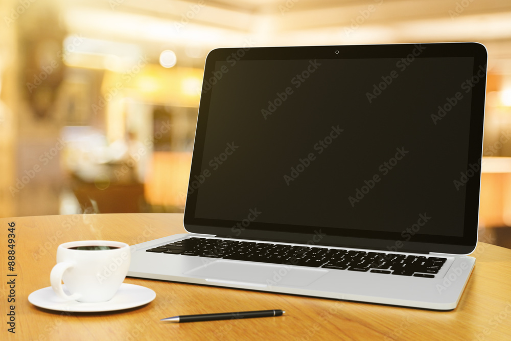 laptop with blank screen on a wooden table with cup of coffee an laptop with blank screen on a wooden table with cup of coffee an