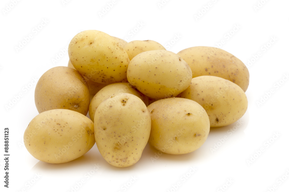 Potatoes on the white background. New harvest. Potatoes on the white background. New harvest.