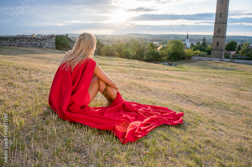 Young woman posing as superhero or wonderwoman photo