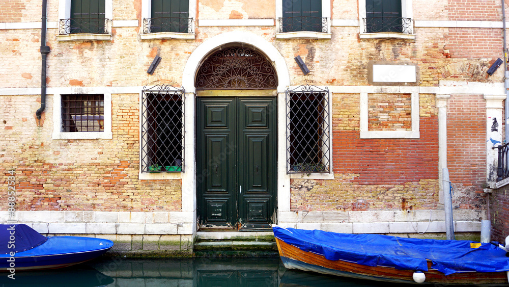 canal and boats with ancient brick wall canal and boats with ancient brick wall