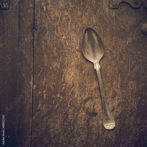 Vintage silverware on rustic wooden background