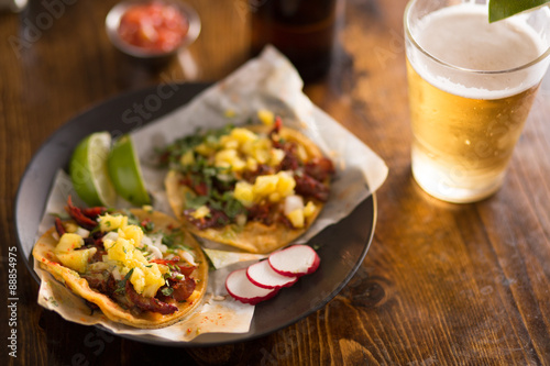 authentic street tacos and beer on plate with copy space