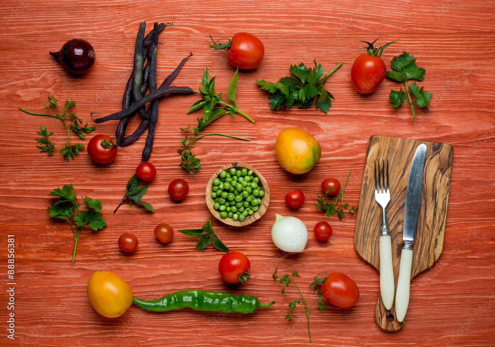 Fresh Organic Vegetables on a White Plate with Knife and Fork Fresh Organic Vegetables on a White Plate with Knife and Fork