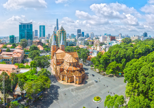 Ho Chi Minh City is a sunny day underneath Notre Dame buildings over a hundred years old, so far is the high-rise buildings for the economic development of Vietnam today photo