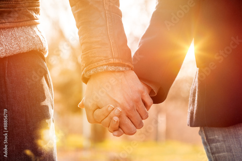 Couple holding hands photo