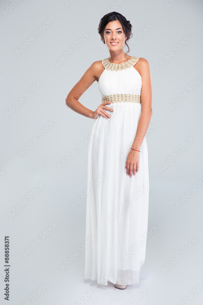 Smiling woman standing in trendy dress