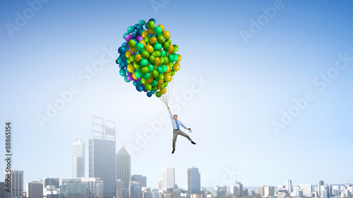 Businessman flies in sky