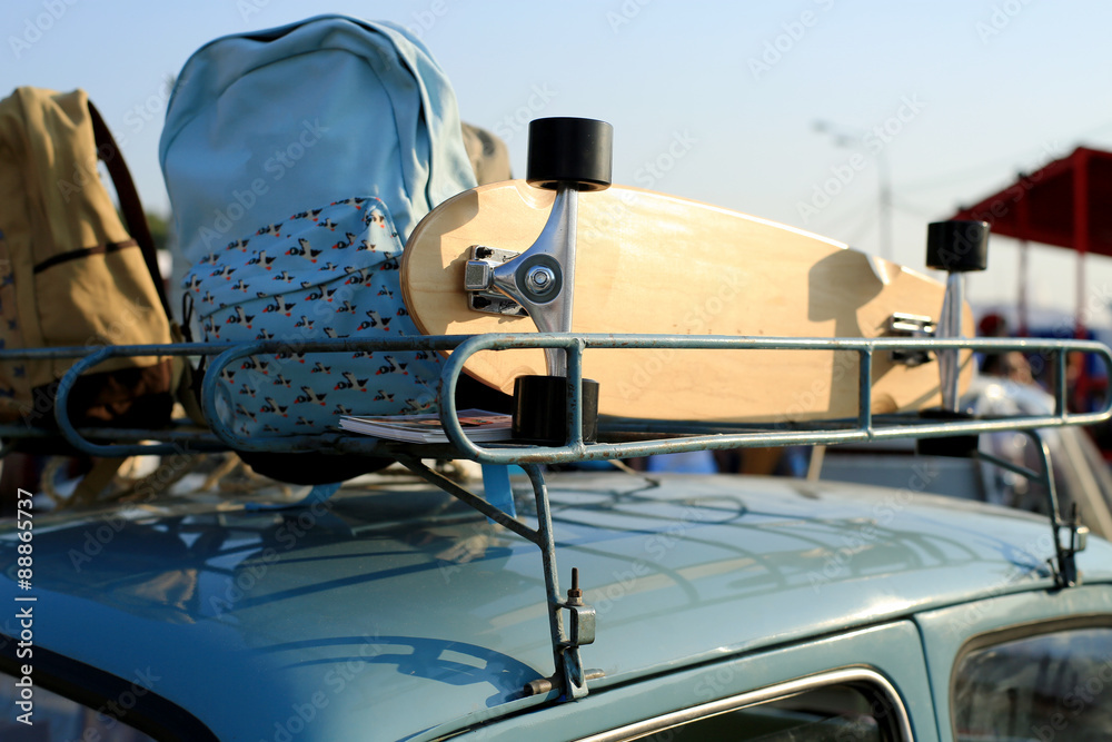 Board for skateboard and backpack on the roof of the car Stock Photo |  Adobe Stock