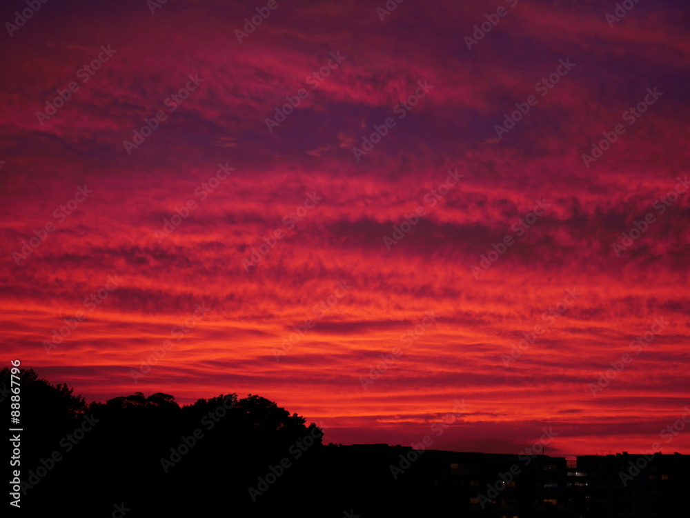 Sky with dramatic cloudy sunset and sun