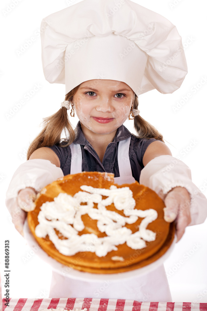 Beautiful happy seven year old girl in chef uniform with shortca Beautiful happy seven year old girl in chef uniform with shortca