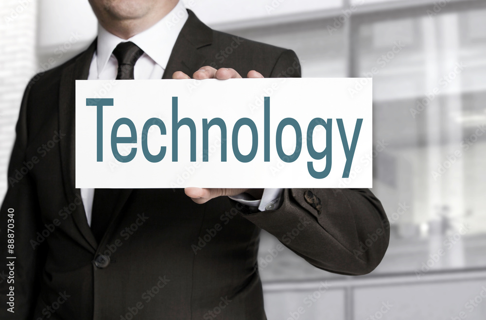 Technology sign is held by businessman Technology sign is held by businessman