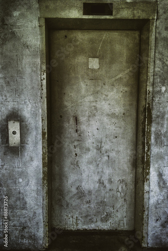 Elevator Door Grunge. Grungy elevator door in a dirty parking garage in an ghetto downtown building of Windsor, Canada.