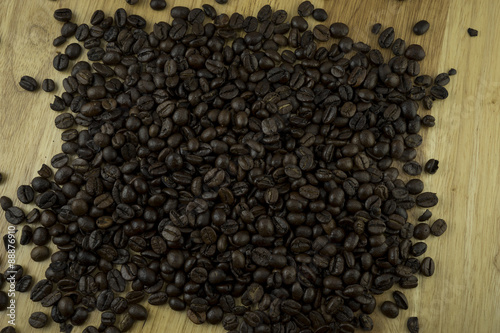 Coffee beans on wood block
