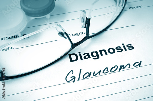 Diagnosis list with Glaucoma and glasses. Eye disorder concept. photo