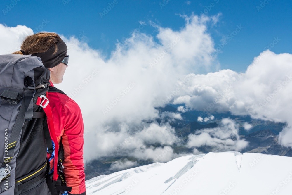 Female alpinist enjoying the view.