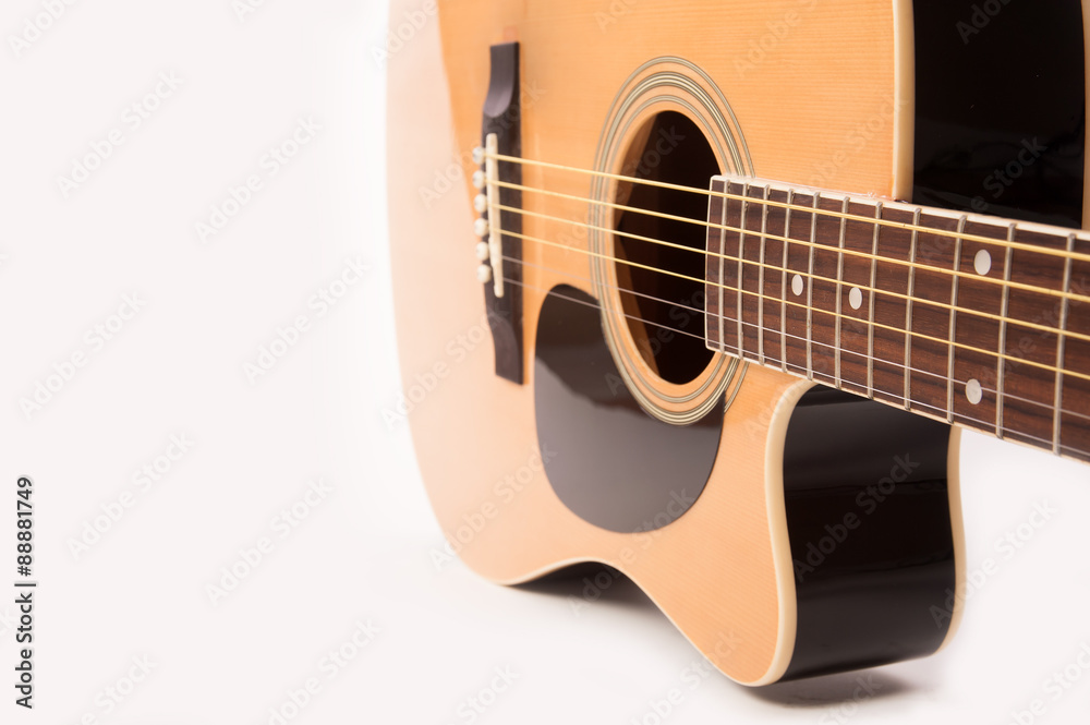 Electric acoustic yellow guitar close up isolated on white background
