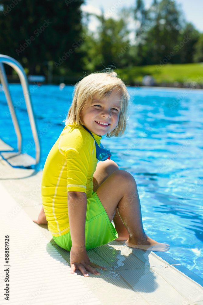 Happy little boy in swimming goggles in the swimming pool Stock Photo |  Adobe Stock