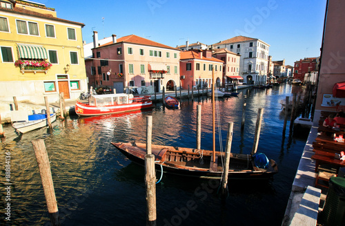 Boats on a canal in the Italian town © alexdoomer