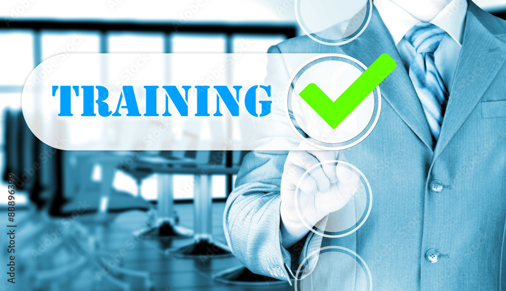Businessman pressing touch screen interface training checkbox Businessman pressing touch screen interface training checkbox