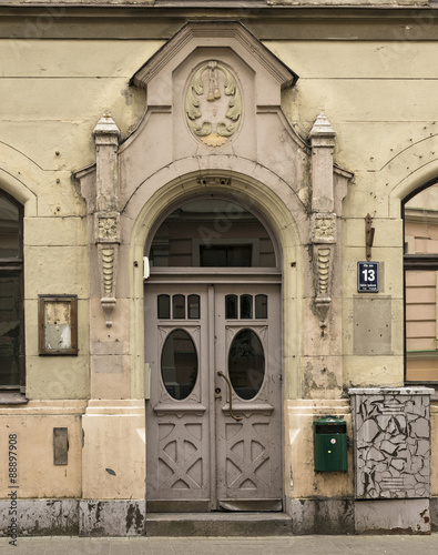 Door of the old apartment building in art Nouveau style at the address: Pils street, 13. Riga, Latvia. photo