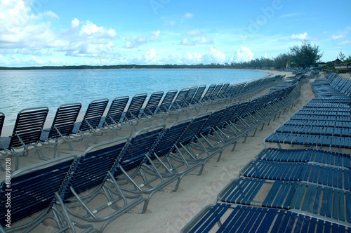 Beach benches lined up photo