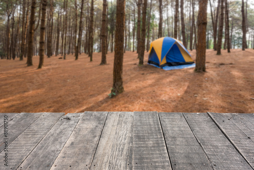 Wood floor and tent in forest background