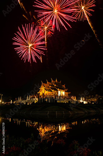 Ho kham luang northern thai style building in Royal Flora temple (ratchaphreuk)in Chiang Mai,Thailand.Firework