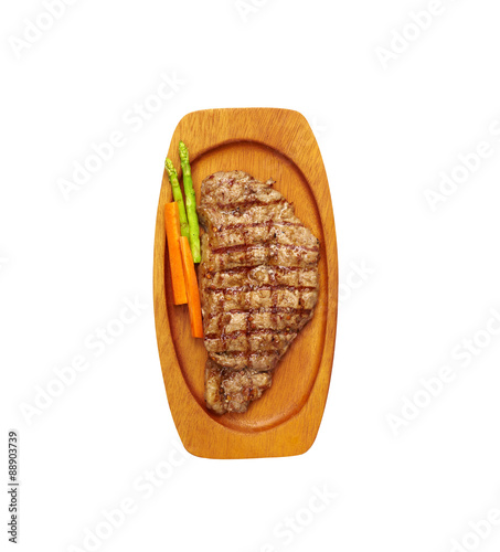 beef steak and vegetable in wooden tray on white background