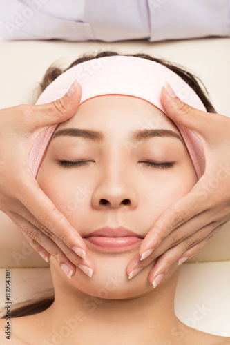 Beauty and Spa - massage of face for woman in spa salon, enjoying a facial massage.
